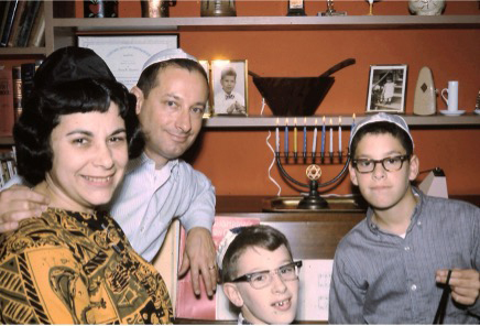 Mom, dad, myself, and my brother David celebrating Hanukah by the piano where I would play “Rock of Ages” circa 1965