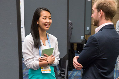 Photo of two people talking. Link to Closely Held Business Stock.
