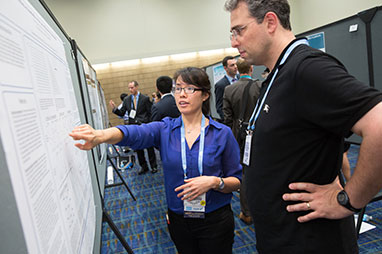 Photo of two people looking at a presentation. Link to What to Give. Photo of two people looking at a presentation. Link to What to Give.