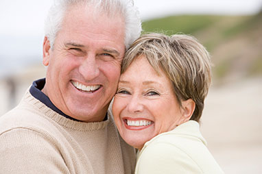 Photo of a man and woman smiling for a picture. Link to Life Stage Gift Planner Ages 45-65 Situations.